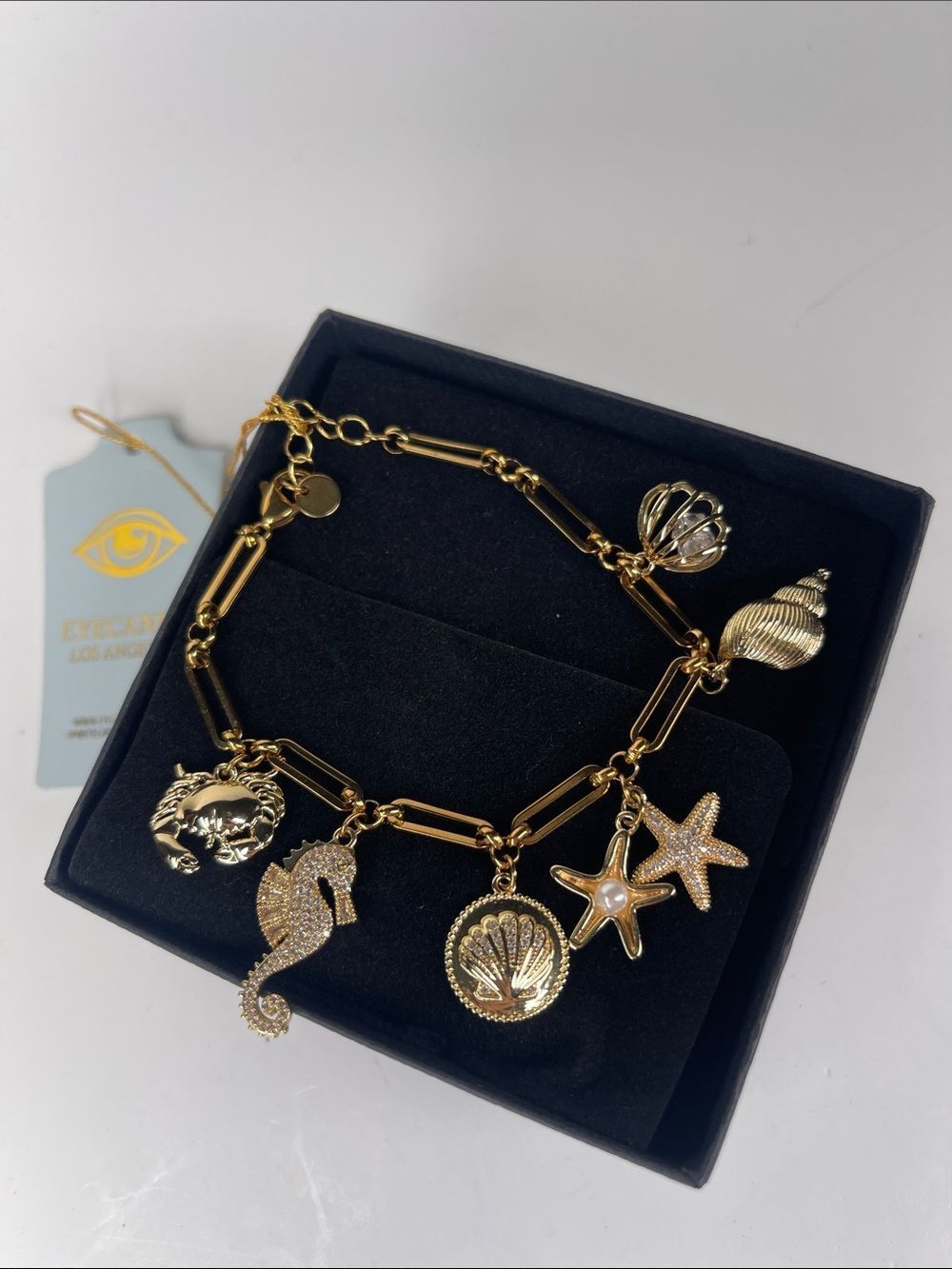 Gold Coastal Charm Bracelet with Pearl Accent - shell, starfish, seahorse charms